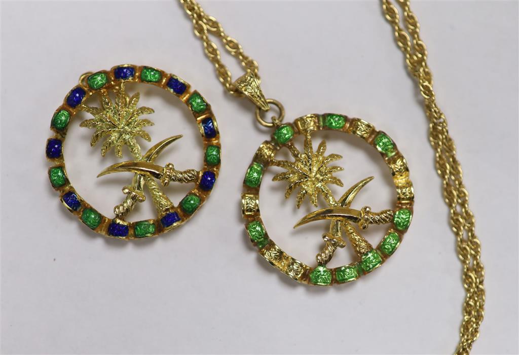 Two modern Italian 750 yellow metal and enamel Emblem of Saudi Arabia circular pendants, one with 750 chain.